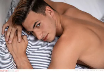 Nude boy showing his goods