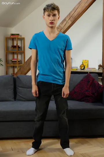 Cute blonde boy getting naked
