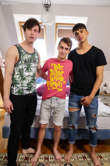 Boys in bed having a threesome