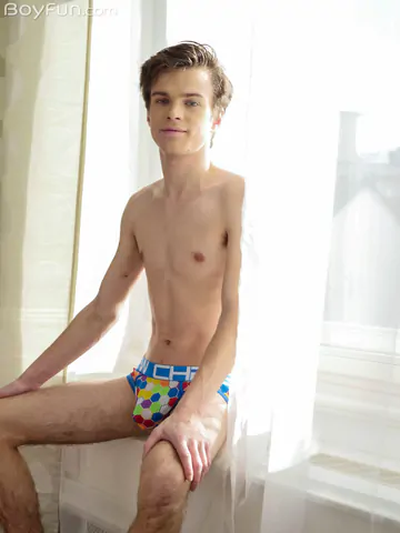 Gay twink showing his goods