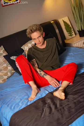 Tattooed guy jerking his cock