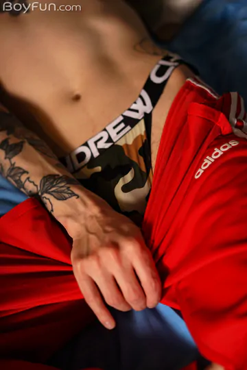 Tattooed guy jerking his cock