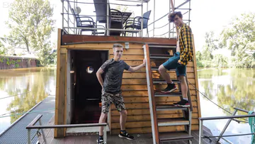 Two guys on a houseboat having sex