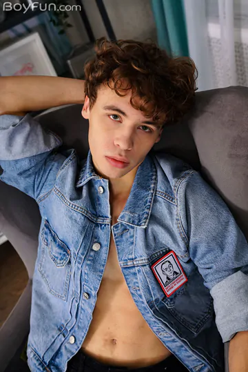 Curly boy with a fit body