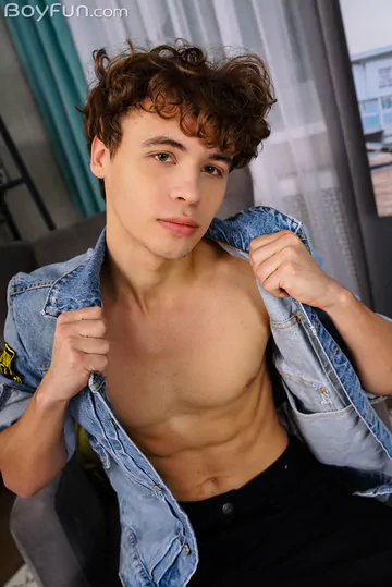Curly boy with a fit body