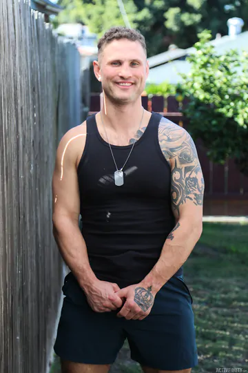 Men with tattoos having bareback sex