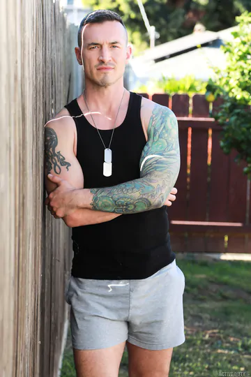 Men with tattoos having bareback sex