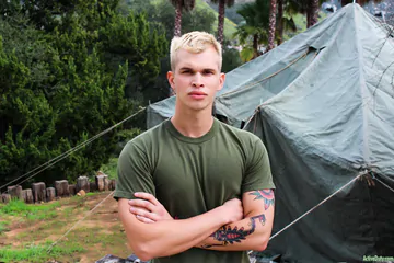 Blonde guy getting naked