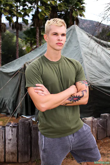 Blonde guy getting naked