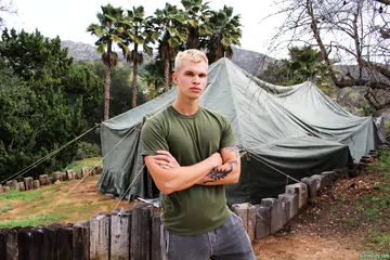 Blonde guy getting naked