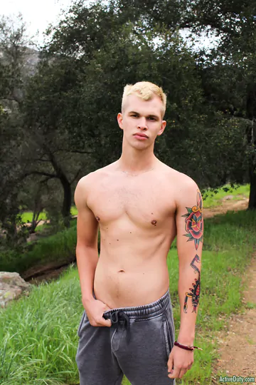 Blonde guy getting naked