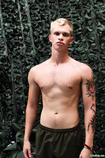 Blonde guy getting naked