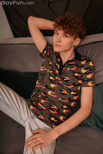 Cute curly redhead playing with his penis