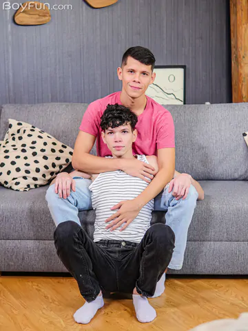 Boys on a grey sofa fucking