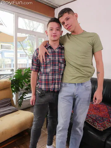 Boys on a black sofa bareback fucking