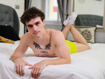 Tattooed guy showing dick and ass