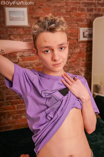 Skinny boy showing his asshole