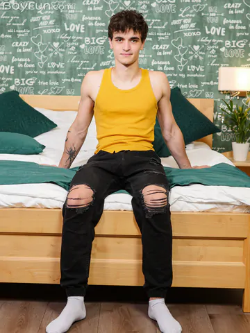 Guy in bed showing stiff dick