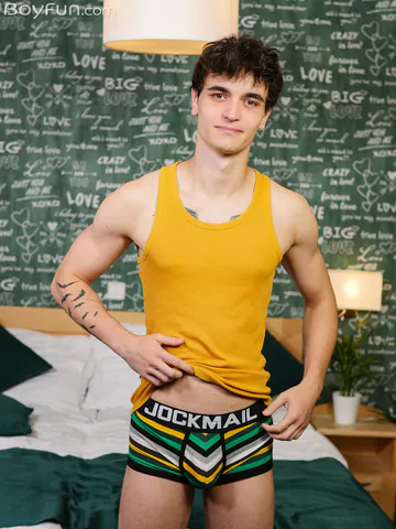 Guy in bed showing stiff dick