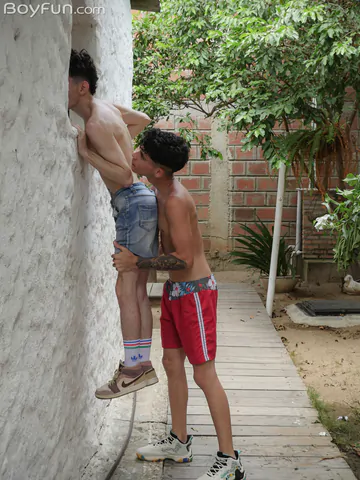 Three boys on a sofa having sex