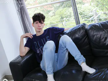 Curly boy with a smooth cock and ass