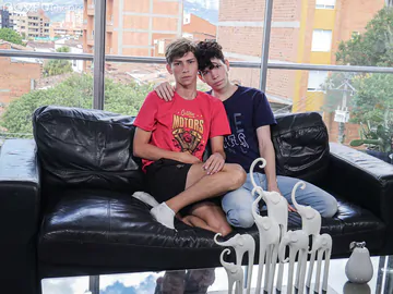 Boys fucking on a black sofa