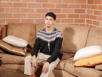 Curly boy with a shaved cock