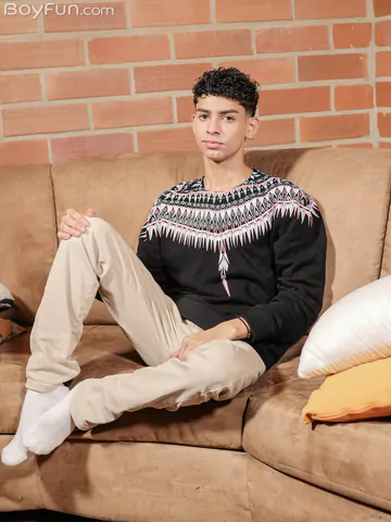 Curly boy with a shaved cock