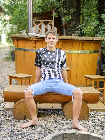 Cute boy getting naked outdoors