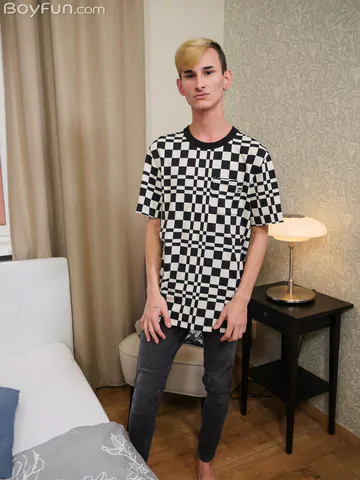 Twink on a bed getting naked