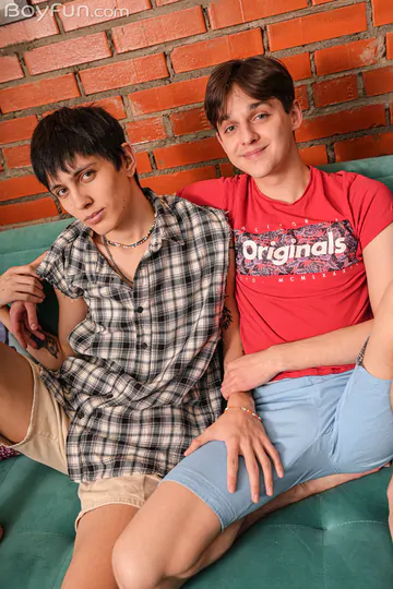 Two boys fucking on a green sofa