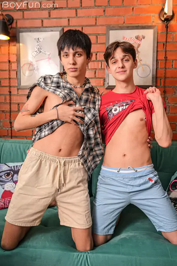 Two boys fucking on a green sofa