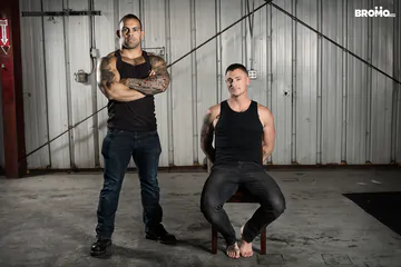 Two dudes fucking in a warehouse