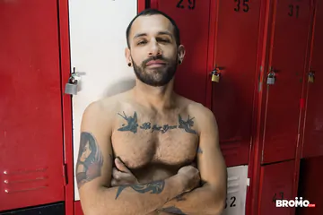 Tattooed Latinos in a locker room
