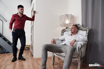 Trashy guys on a red sofa fucking