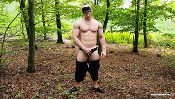Hunk jerking off in the forest