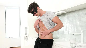 Masked guy on a sofa jerking off