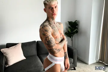 Tattooed guy wanking his big dick