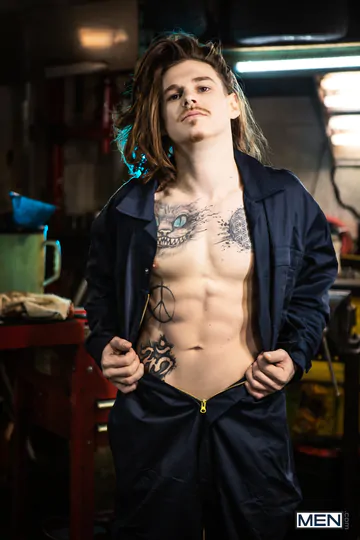 Tattooed guys fucking in a garage