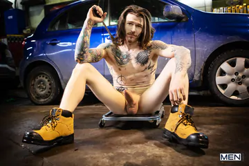 Tattooed guys fucking in a garage