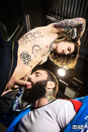 Tattooed guys fucking in a garage
