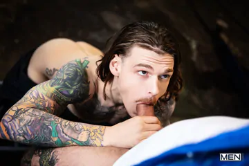 Tattooed guys fucking in a garage