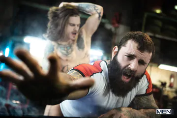 Tattooed guys fucking in a garage