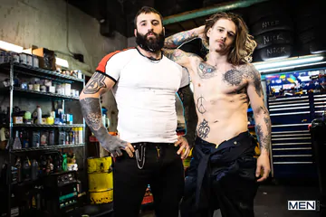 Tattooed guys fucking in a garage