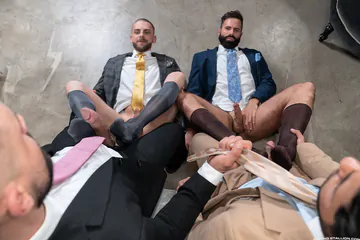 Men in suits having a foursome