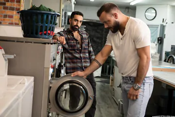 Gay men fucking in the laundry