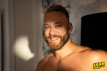 Hunky men on a sofa fucking
