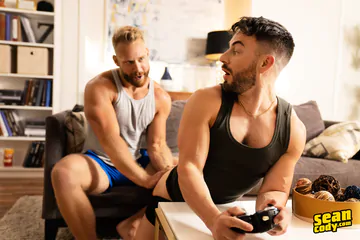 Hunky men on a sofa fucking