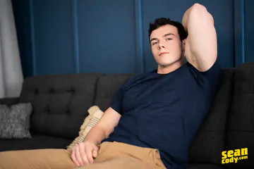 Hunks having sex on a sofa