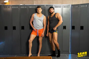 Muscular guys in a locker room